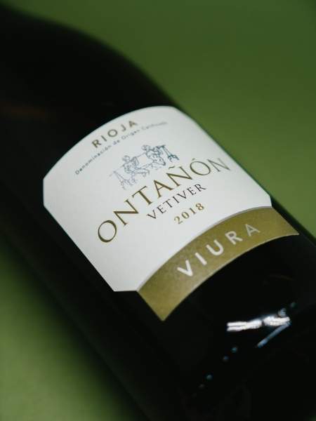 Front Label Details of the Bottle on Green Background