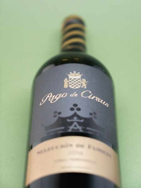 Front Black and Gold Label Details on Green Background
