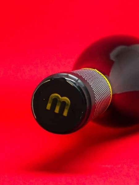 Black and Yellow Cap of Bottle with the Logo