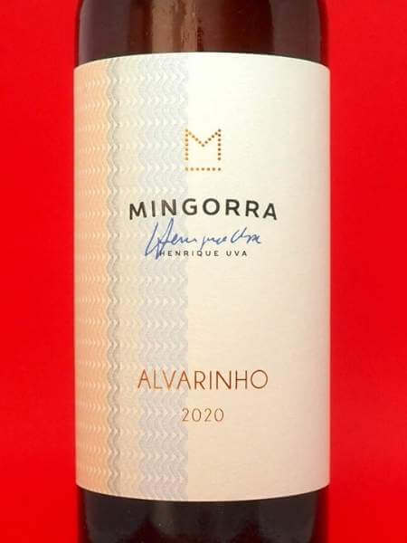Front White Label of Mingorra Alvarinho on Red Background