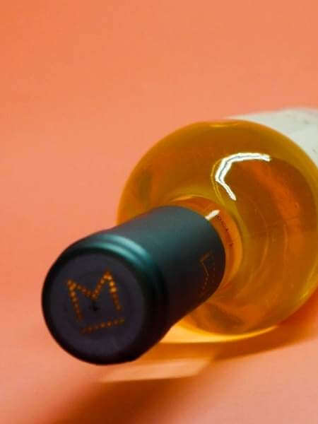 Black and Orange Cap with Logo of the Bottle